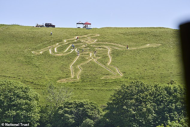 National Trust begins historic restoration of giant chalk figure.